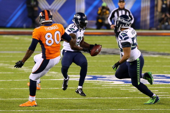 EAST RUTHERFORD, NJ - FEBRUARY 02:  Strong safety Kam Chancellor #31 of the Seattle Seahawks intercepts a pass from quarterback Peyton Manning #18 of the Denver Broncos intended for tight end Julius Thomas #80 of the Denver Broncos in the first quarter du
