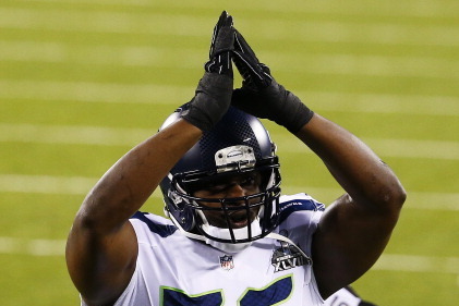 EAST RUTHERFORD, NJ - FEBRUARY 02:  Defensive end Cliff Avril #56 of the Seattle Seahawks reacts to safety against Denver Broncos during first quarter of Super Bowl XLVIII at MetLife Stadium on February 2, 2014 in East Rutherford, New Jersey.  (Photo by T