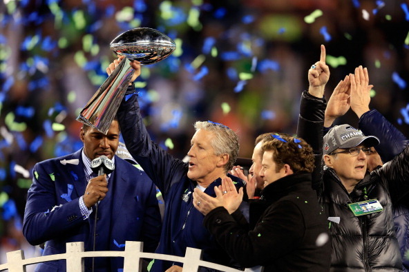 EAST RUTHERFORD, NJ - FEBRUARY 02:  Head coach Pete Carroll of the Seattle Seahawks celebrates with the Vince Lombardi Trophy after their 43-8 victory over the Denver Broncos during Super Bowl XLVIII at MetLife Stadium on February 2, 2014 in East Rutherfo