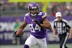 Dec 29, 2013; Minneapolis, MN, USA; Minnesota Vikings wide receiver Cordarrelle Patterson (84) runs with the ball to score a touchdown during the first quarter against the Detroit Lions at Mall of America Field at H.H.H. Metrodome. Mandatory Credit: Brace