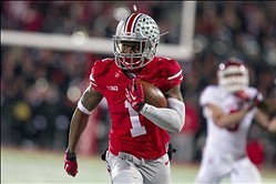 Nov 23, 2013; Columbus, OH, USA;  Ohio State Buckeyes running back Dontre Wilson (1) runs for a touchdown in the third quarter of the game against the Indiana Hoosiers at Ohio Stadium. Ohio State Buckeyes beat Indiana Hoosiers 42-14. Mandatory Credit: Tre