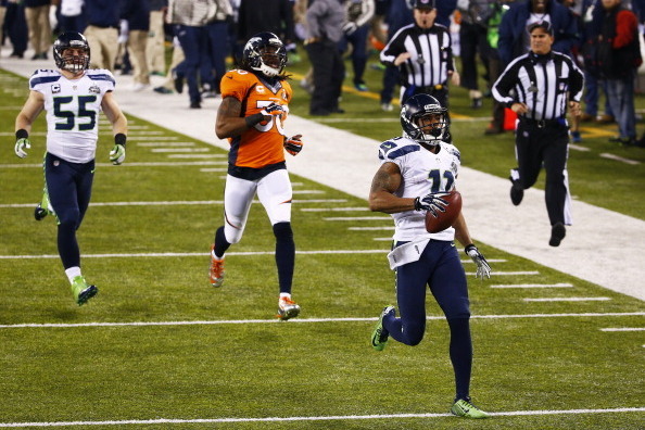 EAST RUTHERFORD, NJ - FEBRUARY 02:  Wide receiver Percy Harvin #11 of the Seattle Seahawks   returns the second half kickoff for 87 yards during Super Bowl XLVIII at MetLife Stadium against the Denver Broncos on February 2, 2014 in East Rutherford, New Je