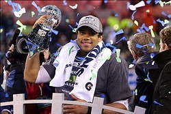 Feb 2, 2014; East Rutherford, NJ, USA; Seattle Seahawks quarterback Russell Wilson (3) celebrates with the Lombardi Trophy after beating the Denver Broncos 43-8 in Super Bowl XLVIII at MetLife Stadium.  Mandatory Credit: Brad Penner-USA TODAY Sports