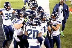 Feb 2, 2014; East Rutherford, NJ, USA; Seattle Seahawks wide receiver Percy Harvin (11) celebrates with teammates after returning a kick for a touchdown against the Denver Broncos in the third quarter in Super Bowl XLVIII at MetLife Stadium.  Mandatory Cr