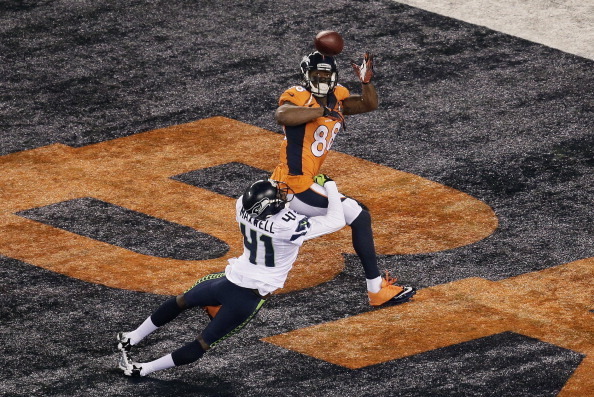 EAST RUTHERFORD, NJ - FEBRUARY 02:  Wide receiver Demaryius Thomas #88 of the Denver Broncos scores on a 14 yard pass during Super Bowl XLVIII against the Seattle Seahawks at MetLife Stadium on February 2, 2014 in East Rutherford, New Jersey.  (Photo by W