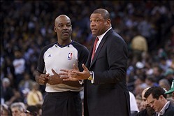 Mar 14, 2012; Oakland, CA, USA; Boston Celtics head coach Doc Rivers talks to NBA referee Haywoode Workman (66) during the second quarter against the Golden State Warriors at Oracle Arena. Boston defeated Golden State 105-103. Mandatory Credit: Jason O. W