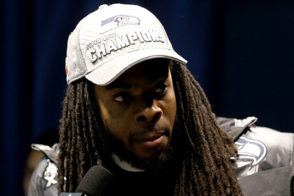 EAST RUTHERFORD, NJ - FEBRUARY 02:  Cornerback Richard Sherman #25 of the Seattle Seahawks in the inerview room after the Seahawks 43-8 victory against the Denver Broncos during Super Bowl XLVIII at MetLife Stadium on February 2, 2014 in East Rutherford, 