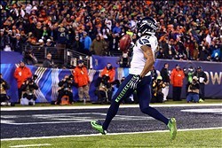Feb 2, 2014; East Rutherford, NJ, USA; Seattle Seahawks wide receiver Percy Harvin (11) returns a kick for a touchdown against the Denver Broncos in the third quarter in Super Bowl XLVIII at MetLife Stadium.  Mandatory Credit: Mark J. Rebilas-USA TODAY Sp