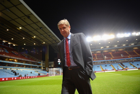 BIRMINGHAM, ENGLAND - JANUARY 13: Manager Arsene Wenger of Arsenal walks pitchside ahead of the Barclays Premier League match between Aston Villa and Arsenal at Villa Park on January 13, 2014 in Birmingham, England.  (Photo by Michael Regan/Getty Images)