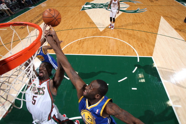 MILWAUKEE, WI - January 7:  Draymond Green #23 of the Golden State Warriors blocks a shot against Ekpe Udoh #5 of the Milwaukee Bucks on January 7, 2014 at the BMO Harris Bradley Center in Milwaukee, Wisconsin. NOTE TO USER:  User expressly acknowledges a