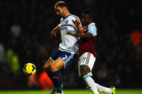 LONDON, ENGLAND - NOVEMBER 23:  Branislav Ivanovic of Chelsea holds off  Modibo Maiga of West Ham during the Barclays Premier League match between West Ham United and Chelsea at Boleyn Ground on November 23, 2013 in London, England.  (Photo by Mike Hewitt