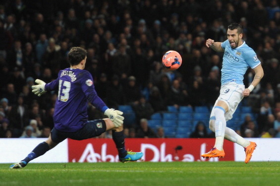 MANCHESTER, ENGLAND - JANUARY 15:  Alvaro Negredo of Manchester City scores the second goal past Simon Eastwood of Blackburn Rovers during the Budweiser FA Cup Third Round Replay match between Manchester City and Blackburn Rovers at the Etihad Stadium on 