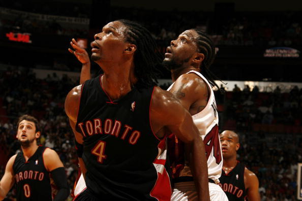 MIAMI - MARCH 28: Udonis Haslem #40 of the Miami Heat battles for a rebound against Chris Bosh #4 of the Toronto Raptors on March 28, 2010 at American Airlines Arena in Miami, Florida. NOTE TO USER: User expressly acknowledges and agrees that, by download