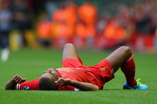 LIVERPOOL, ENGLAND - SEPTEMBER 01:  Glen Johnson of Liverpool lies injured during the Barclays Premier League match between Liverpool and Manchester United at Anfield on September 01, 2013 in Liverpool, England.  (Photo by Alex Livesey/Getty Images)