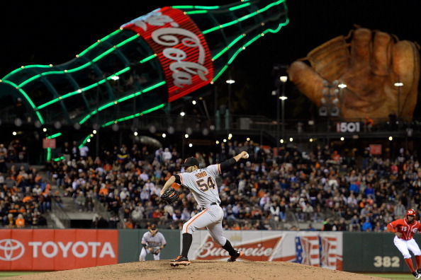 SAN FRANCISCO, CA - JULY 23:  Sergio Romo #54 of the San Francisco Giants pitches in the eighth inning against the Cincinnati Reds at AT&T Park on July 23, 2013 in San Francisco, California.  (Photo by Thearon W. Henderson/Getty Images)