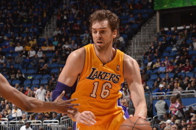 ORLANDO, FL - JANUARY 24: Pau Gasol #16 of the Los Angeles Lakers drives to the basket against the Orlando Magic on January 24, 2014 at Amway Center in Orlando, Florida. NOTE TO USER: User expressly acknowledges and agrees that, by downloading and or usin