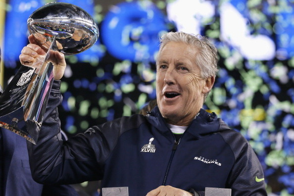 EAST RUTHERFORD, NJ - FEBRUARY 02:  Head coach Pete Carroll of the Seattle Seahawks celebrates with the Vince Lombardi Trophy after their 43-8 victory over the Denver Broncos during Super Bowl XLVIII at MetLife Stadium on February 2, 2014 in East Rutherfo