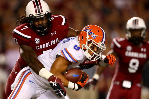 COLUMBIA, SC - NOVEMBER 16:  Jadeveon Clowney #7 of the South Carolina Gamecocks tackles Trey Burton #8 of the Florida Gators during their game at Williams-Brice Stadium on November 16, 2013 in Columbia, South Carolina.  (Photo by Streeter Lecka/Getty Ima