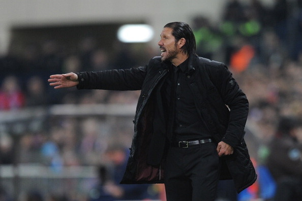MADRID, SPAIN - JANUARY 11:  Head coach Diego Simeone of Club Atletico de Madrid reacts during the La Liga match between Club Atletico de Madrid and FC Barcelona  at Vicente Calderon Stadium on January 11, 2014 in Madrid, Spain.  (Photo by Denis Doyle/Get