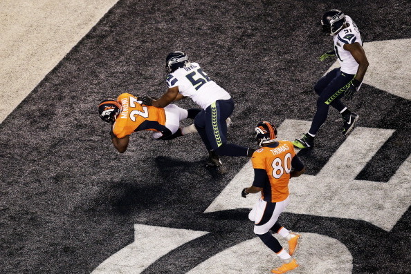 EAST RUTHERFORD, NJ - FEBRUARY 02:  Running back Knowshon Moreno #27 of the Denver Broncos recovers the ball in the endzone for a safety against the Seattle Seahawks during the first quarter of Super Bowl XLVIII at MetLife Stadium on February 2, 2014 in E