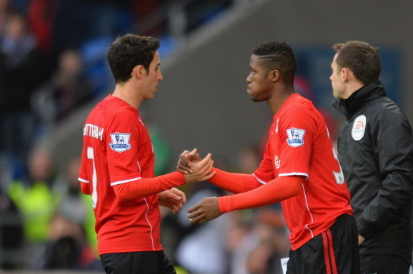 CARDIFF, WALES - FEBRUARY 01:  Peter Whittingham of Cardiff is substituted by Wilfried Zaha in the first half during the Barclays Premier League match between Cardiff City and Norwich City at Cardiff City Stadium on February 1, 2014 in Cardiff, Wales.  (P