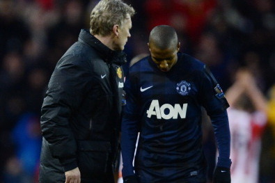 STOKE ON TRENT, ENGLAND - FEBRUARY 01:  David Moyes (L), manager of Manchester United walks off with Ashley Young after the Barclays Premier League match between Stoke City and Manchester United at Britannia Stadium on February 1, 2014 in Stoke on Trent, 