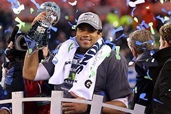Feb 2, 2014; East Rutherford, NJ, USA; Seattle Seahawks quarterback Russell Wilson (3) celebrates with the Lombardi Trophy after beating the Denver Broncos 43-8 in Super Bowl XLVIII at MetLife Stadium.  Mandatory Credit: Brad Penner-USA TODAY Sports