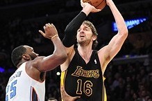 January 31, 2014; Los Angeles, CA, USA; Los Angeles Lakers center Pau Gasol (16) shoots a basket against the defense of Charlotte Bobcats center Al Jefferson (25) during the second half at Staples Center. Mandatory Credit: Gary A. Vasquez-USA TODAY Sports