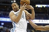 Dec 23, 2013; Denver, CO, USA; Denver Nuggets guard Andre Miller (24) loses control of the ball in front of Golden State Warriors guard Kent Bazemore (20) during the first half at Pepsi Center. Mandatory Credit: Chris Humphreys-USA TODAY Sports