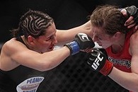 Oct 19, 2013; Houston, TX, USA; Sarah Kaufman (red gloves) fights against Jessica Eye (blue gloves) in their women's bantamweight bout during UFC 166 at Toyota Center. Mandatory Credit: Andrew Richardson-USA TODAY Sports