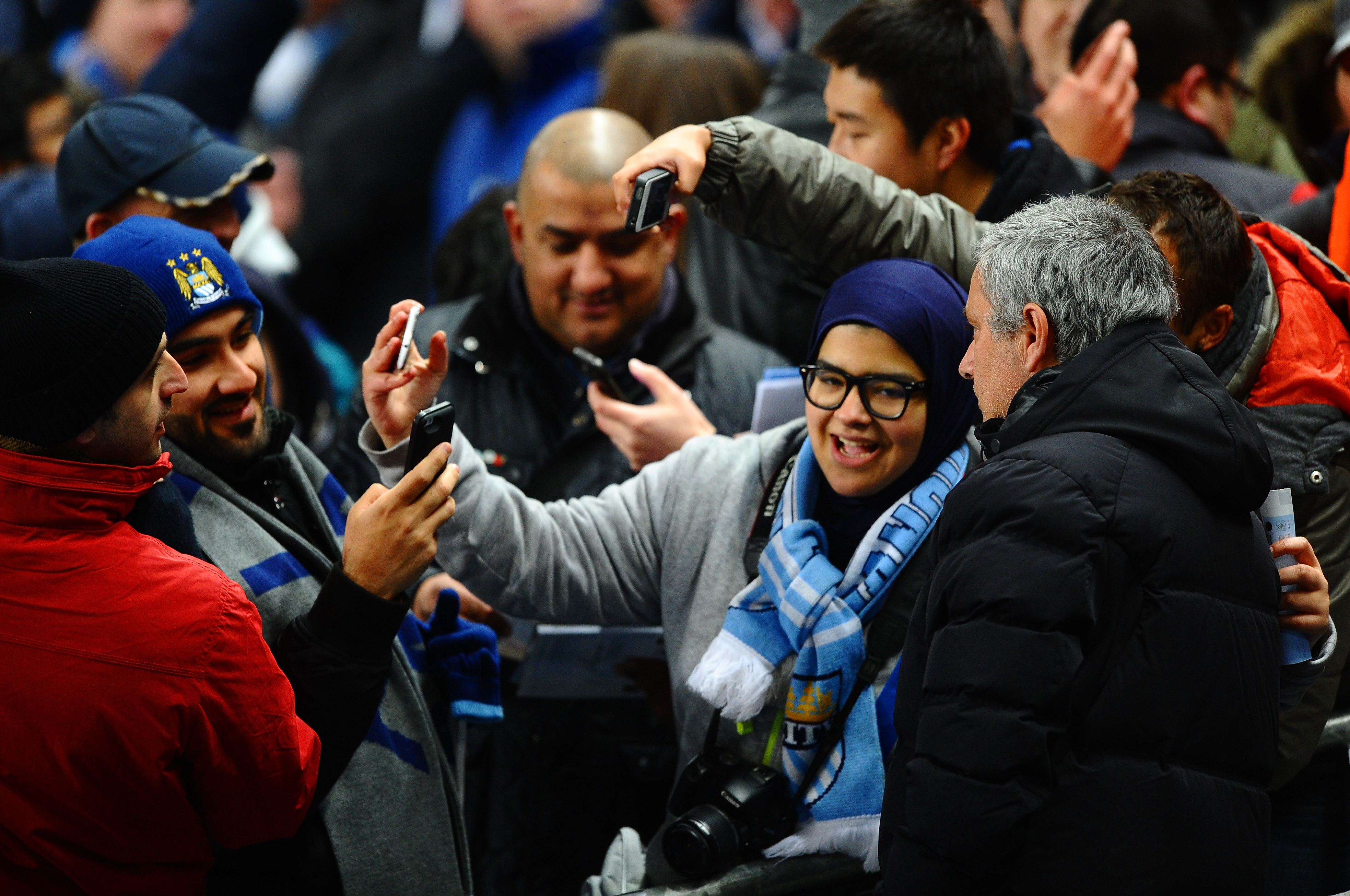 MANCHESTER, ENGLAND - FEBRUARY 03:  Jose Mourinho manager of Chelsea poses for a photograph with fans during the Barclays Premier League match between Manchester City and Chelsea at Etihad Stadium on February 3, 2014 in Manchester, England.  (Photo by Lau