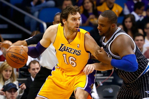 ORLANDO, FL - JANUARY 24:  Glen Davis #11 of the Orlando Magic gaurds Pau Gasol #16 of the Los Angeles Lakers during the game at Amway Center on January 24, 2014 in Orlando, Florida.  NOTE TO USER: User expressly acknowledges and agrees that, by downloadi