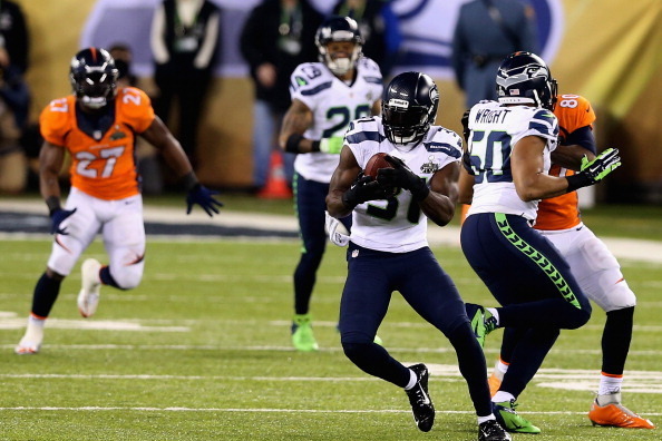 EAST RUTHERFORD, NJ - FEBRUARY 02: Strong safety Kam Chancellor #31 of the Seattle Seahawks  intercepts a pass from Peyton Manning of the Denver Broncos during Super Bowl XLVIII at MetLife Stadium on February 2, 2014 in East Rutherford, New Jersey.  (Phot