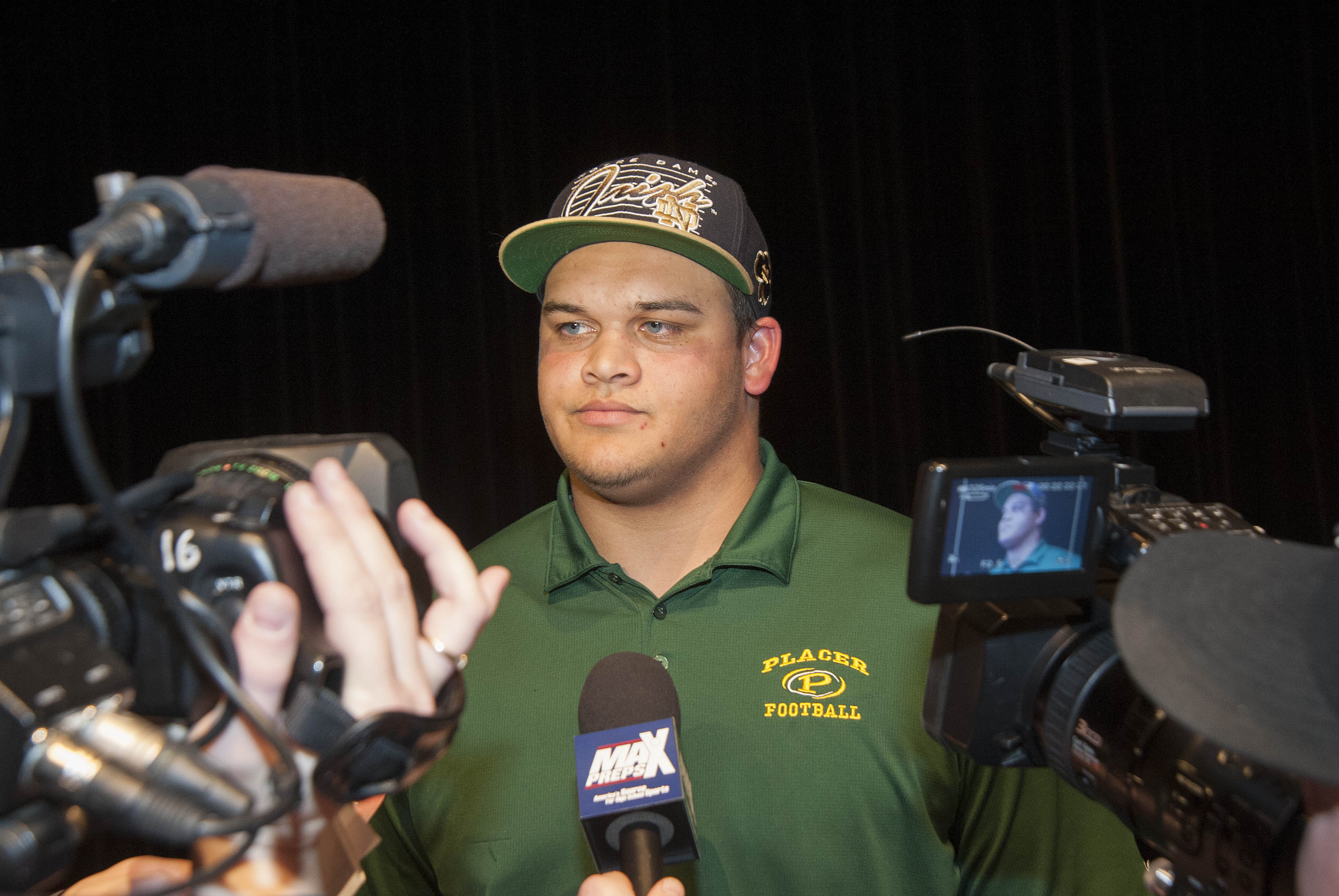 Feb 6, 2013; Auburn, CA, USA; Eddie Vanderdoes during interviews after announcing his intentions to attend Notre Dame on national signing day at Placer High School. Mandatory Credit: Ed Szczepanski-USA TODAY Sports