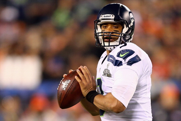 EAST RUTHERFORD, NJ - FEBRUARY 02:  Quarterback Russell Wilson #3 of the Seattle Seahawks throws the ball during the second quarter  of Super Bowl XLVIII against the Denver Broncos at MetLife Stadium on February 2, 2014 in East Rutherford, New Jersey.  (P