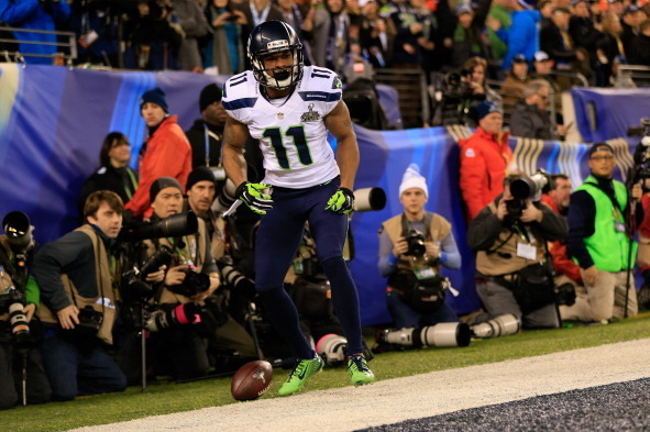 EAST RUTHERFORD, NJ - FEBRUARY 02:  Wide receiver Percy Harvin #11 of the Seattle Seahawks runs for 30 yards during Super Bowl XLVIII at MetLife Stadium against the Denver Broncos  on February 2, 2014 in East Rutherford, New Jersey.  (Photo by Jamie Squir