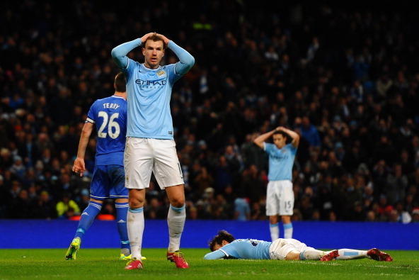 MANCHESTER, ENGLAND - FEBRUARY 03:  Edin Dzeko of Manchester City puts his hands on his heads after David Silva of Manchester City's misses a  chance on goal during the Barclays Premier League match between Manchester City and Chelsea at Etihad Stadium on