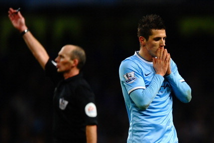 MANCHESTER, ENGLAND - FEBRUARY 03:A dejected Steven Jovetic of Manchester City reacts  during the Barclays Premier League match between Manchester City and Chelsea at Etihad Stadium on February 3, 2014 in Manchester, England.  (Photo by Laurence Griffiths