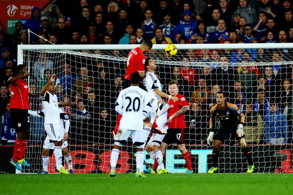CARDIFF, WALES - NOVEMBER 03:  Steven Caulker of Cardiff City (4) rises highest to score their first goal with a header during the Barclays Premier League match between Cardiff City and Swansea City at Cardiff City Stadium on November 3, 2013 in Cardiff, 
