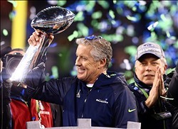 Feb 2, 2014; East Rutherford, NJ, USA; Seattle Seahawks head coach Pete Carroll hoists the Vince Lombardi Trophy after Super Bowl XLVIII against the Denver Broncos at MetLife Stadium.  Mandatory Credit: Mark J. Rebilas-USA TODAY Sports