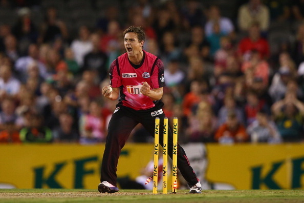 MELBOURNE, AUSTRALIA - JANUARY 18:  Stephen OKeefe of the Sixers celebrates as he runs out Alex Doolan of the Renegades during the Big Bash League match between the Melbourne Renegades and the Sydney Sixers at Etihad Stadium on January 18, 2014 in Melbour