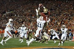 Jan 6, 2014; Pasadena, CA, USA; Florida State Seminoles wide receiver Kelvin Benjamin (1) catches a touchdown pass over Auburn Tigers cornerback Chris Davis (11) during the second half of the 2014 BCS National Championship game at the Rose Bowl.  Mandator