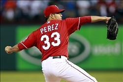 Sep 30, 2013; Arlington, TX, USA; Texas Rangers starting pitcher Martin Perez throws a pitch against the Tampa Bay Rays during the first inning at Rangers Ballpark at Arlington. Mandatory Credit: Tim Heitman-USA TODAY Sports