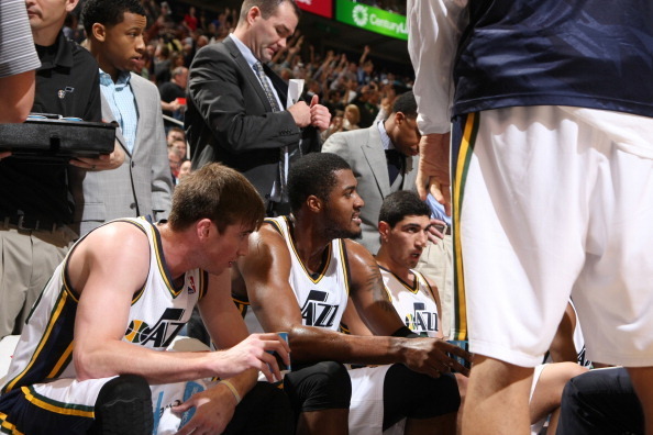 SALT LAKE CITY, UT - NOVEMBER 18:  Gordon Hayward #20, Derrick Favors #15 and Enes Kanter #0 of the Utah Jazz listen during a timeout against the Golden State Warriors at EnergySolutions Arena on November 18, 2013 in Salt Lake City, Utah. NOTE TO USER: Us