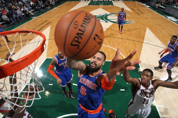 MILWAUKEE, WI - FEBRUARY 3: Tyson Chandler #6 of the New York Knicks shoots against Brandon Knight #11 of the Milwaukee Bucks on February 3, 2014 at the BMO Harris Bradley Center in Milwaukee, Wisconsin. NOTE TO USER:  User expressly acknowledges and agre