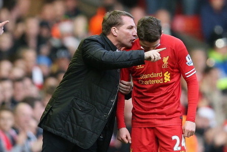 LIVERPOOL, ENGLAND - DECEMBER 21:   Liverpool manager Brendan Rodgers speaks with Joe Allen during the Barclays Premier League match between Liverpool and Cardiff City at Anfield at Anfield on December 21, 2013 in Liverpool, England.  (Photo by Clive Brun