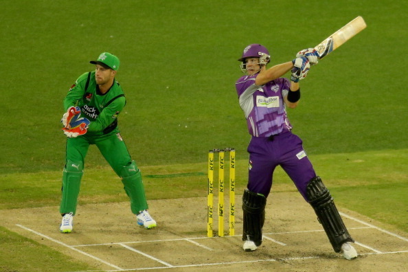 MELBOURNE, AUSTRALIA - FEBRUARY 04:  Tim Paine of the Hurricanes bats as Stars wicketkeeper Matthew Wade looks on during the Big Bash League Semi Final match between the Melbourne Stars and the Hobart Hurricanes at Melbourne Cricket Ground on February 4, 
