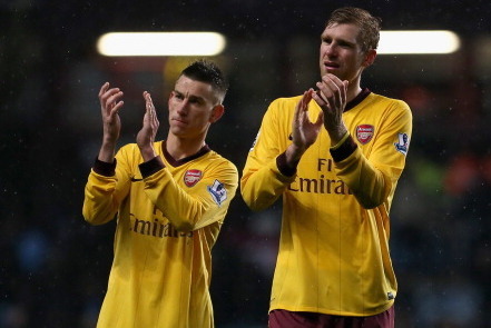 BIRMINGHAM, ENGLAND - NOVEMBER 24:  Dejected Laurent Koscielny and Per Mertesacker of Arsenal applaud the fans after a draw in the Barclays Premier League match between Aston Villa and Arsenal at Villa Park on November 24, 2012 in Birmingham, England.  (P