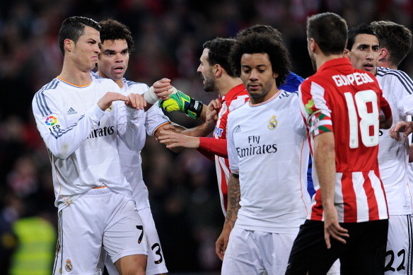 BILBAO, SPAIN - FEBRUARY 02:  Cristiano Ronaldo of Real Madrid CF argues with Athletic Club players during the La Liga match between Athletic Club and Real Madrid CF at San Mames Stadium on February 2, 2014 in Bilbao, Spain.  (Photo by David Ramos/Getty I