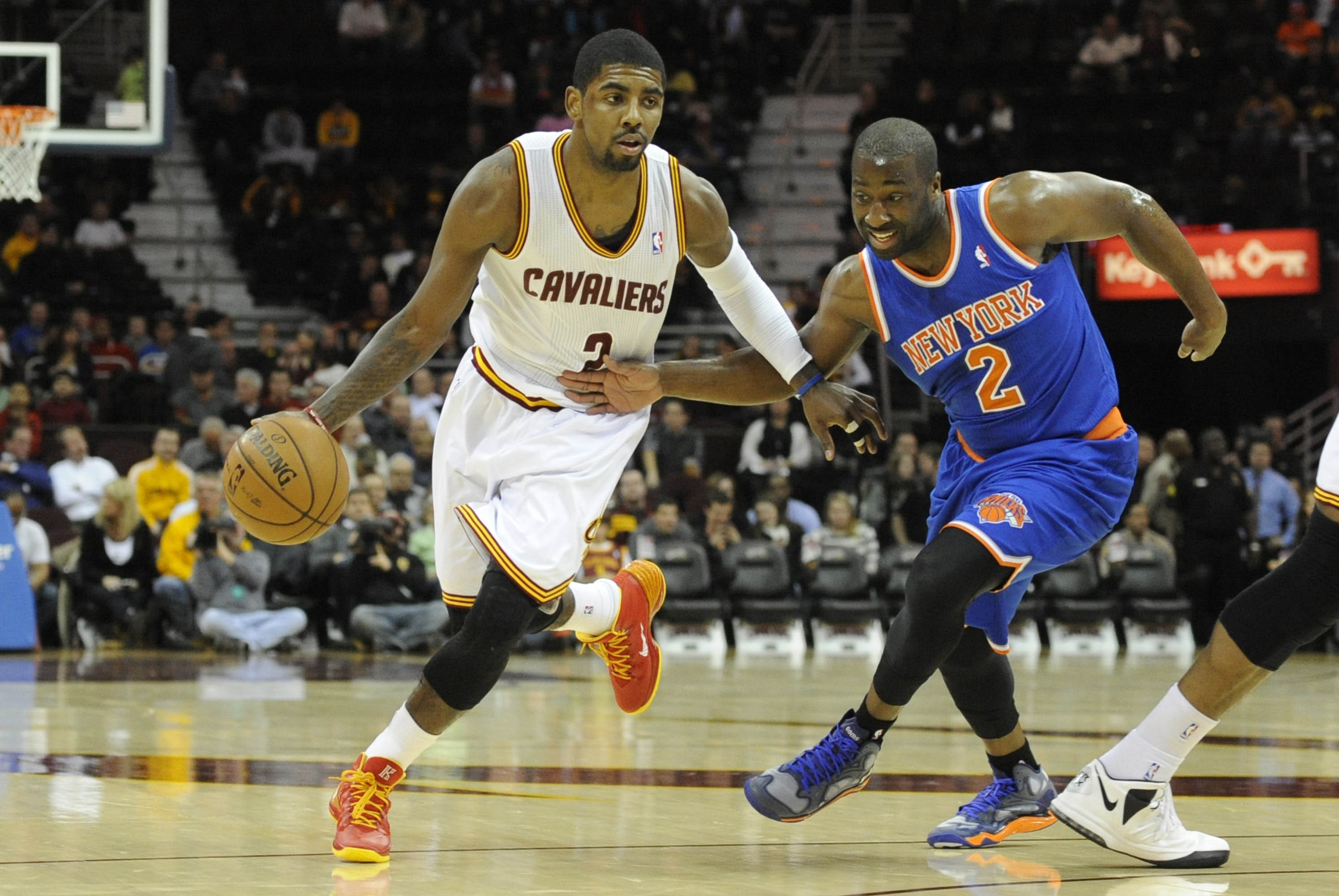 Dec 10, 2013; Cleveland, OH, USA; Cleveland Cavaliers point guard Kyrie Irving (2) drives against New York Knicks point guard Raymond Felton (2) in the first quarter at Quicken Loans Arena. Mandatory Credit: David Richard-USA TODAY Sports